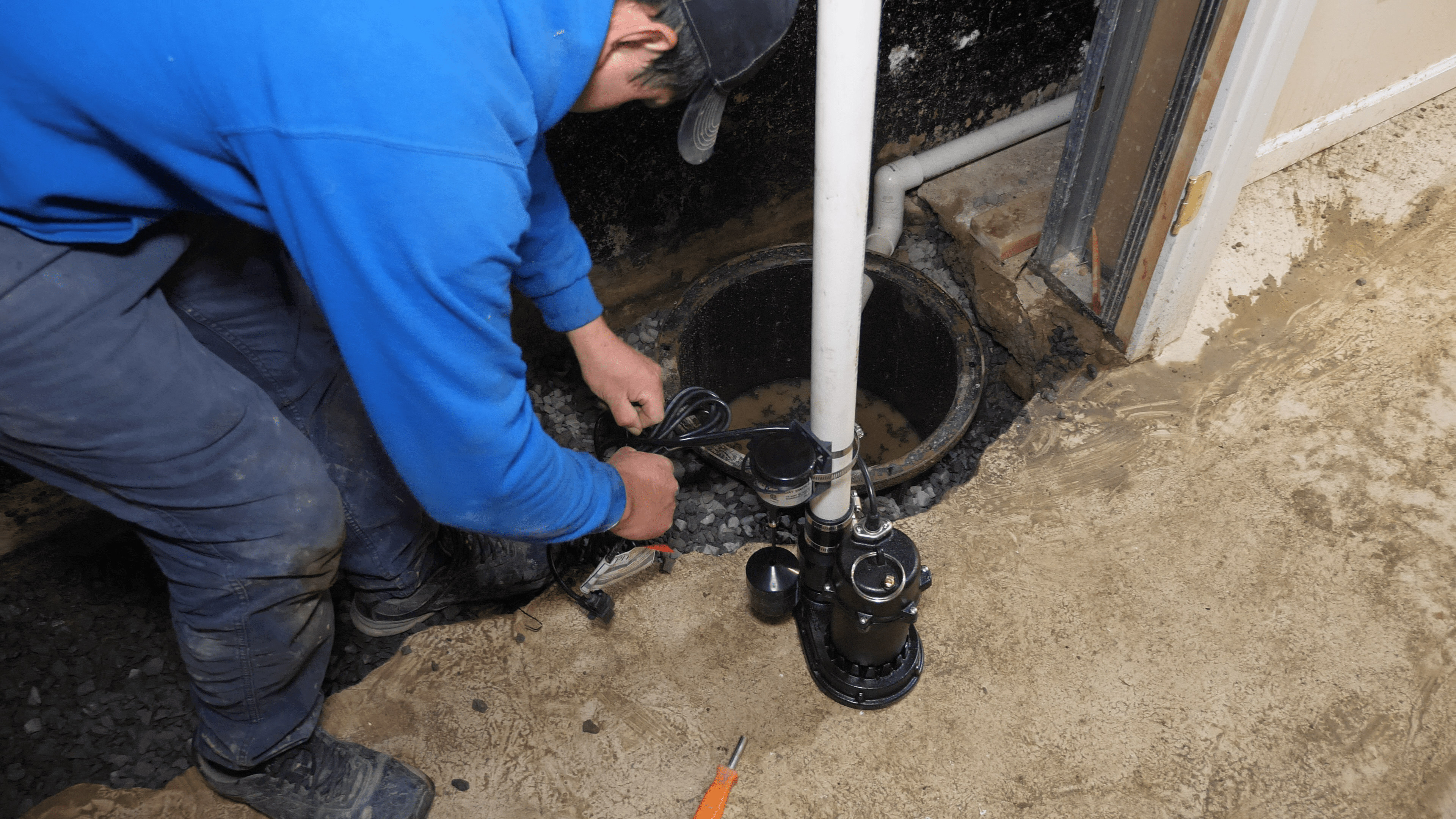 Does Your Kingston Home Need a Sump Pump? A Homeowner's Guide 1 Sump pump installation Kingston - sump pump in a basement