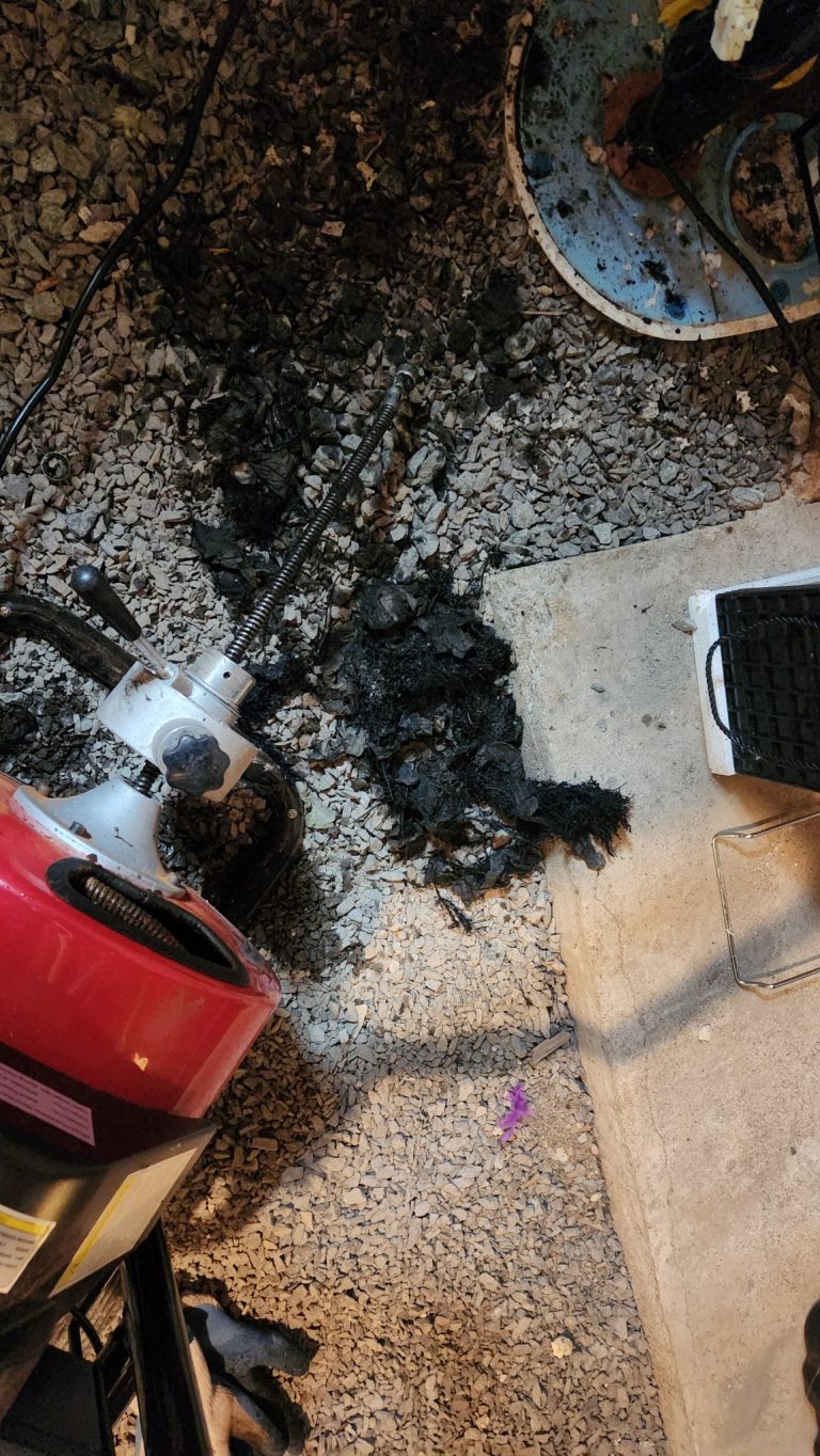 Drain cleaning Kingston - drain machine and the blockage removed from a home's drain