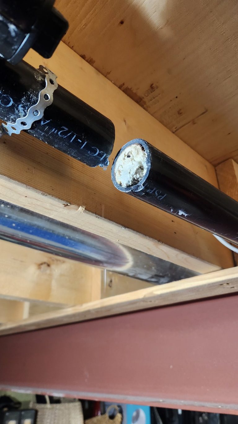 Drain cleaning Kingston - inside a clogged drain pipe cut open during a repair